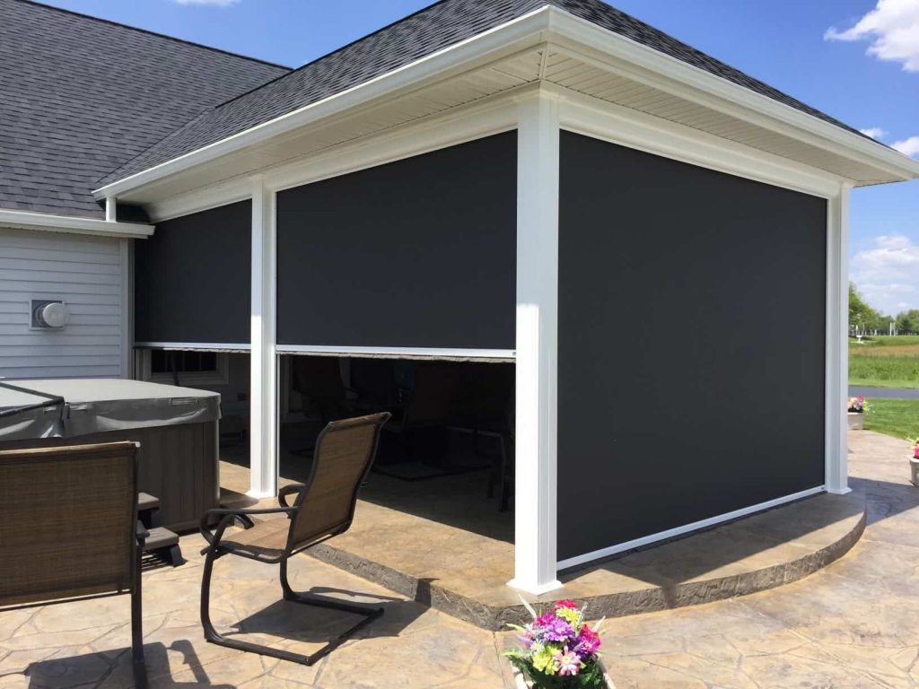 Prestige Shade - Elite Outdoor Environments Sun shade being deployed on outdoor patio to provide complete protection